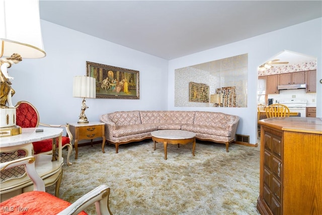 carpeted living room featuring visible vents