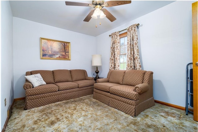 carpeted living room with baseboards and ceiling fan