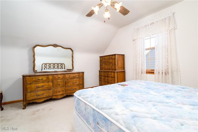 bedroom with carpet floors, a ceiling fan, and vaulted ceiling