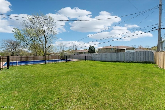 view of yard featuring a fenced in pool and a fenced backyard
