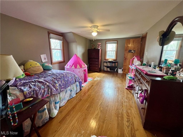 bedroom featuring ceiling fan and light wood-style flooring