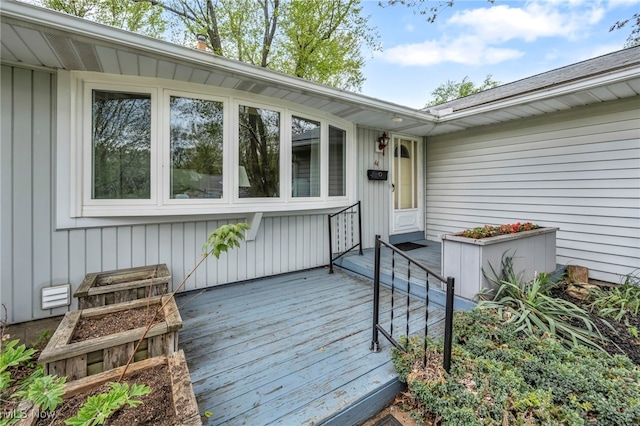 property entrance with a wooden deck