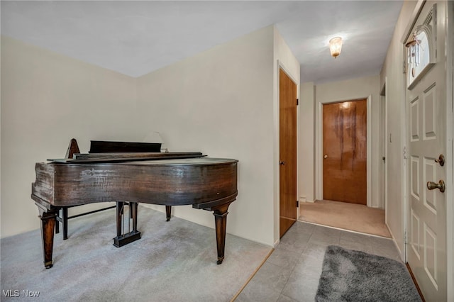 interior space with tile patterned floors and carpet flooring