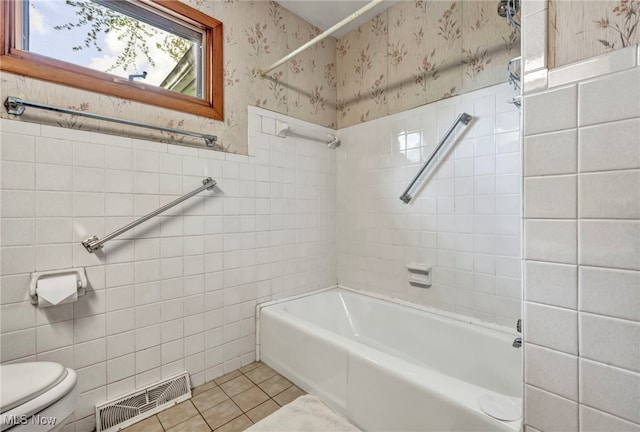 full bathroom with tile patterned flooring, toilet, wallpapered walls, tile walls, and visible vents