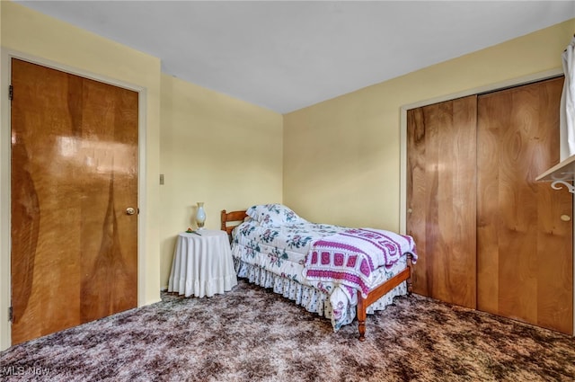 carpeted bedroom with a closet