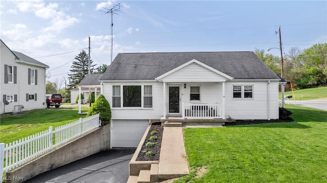 view of front facade featuring covered porch, an attached garage, fence, and a shingled roof