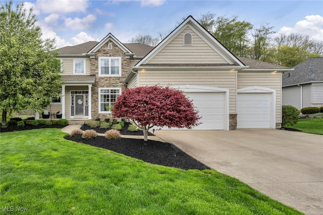 view of front of property featuring a garage, a front yard, driveway, and stone siding