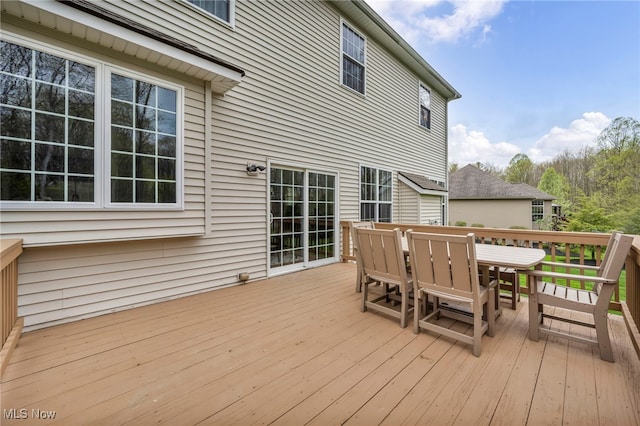 deck featuring outdoor dining area