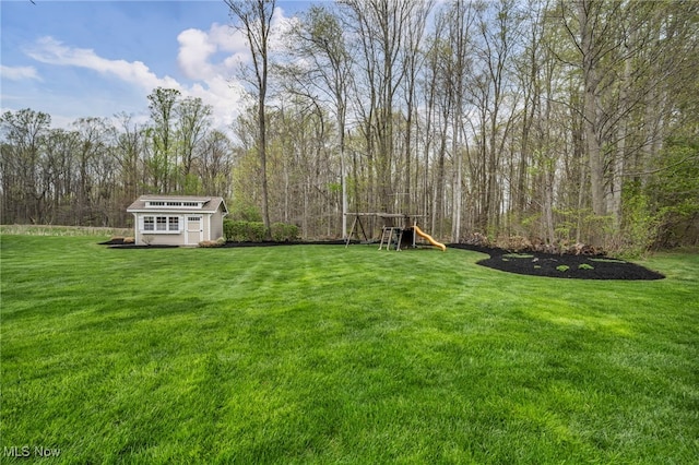 view of yard with an outbuilding and a storage shed