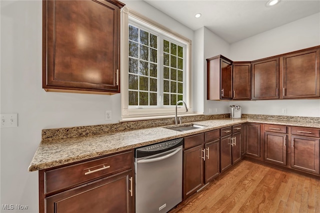 kitchen with light stone countertops, a sink, light wood-style flooring, recessed lighting, and stainless steel dishwasher