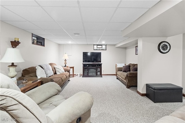 carpeted living area with baseboards, recessed lighting, and a paneled ceiling