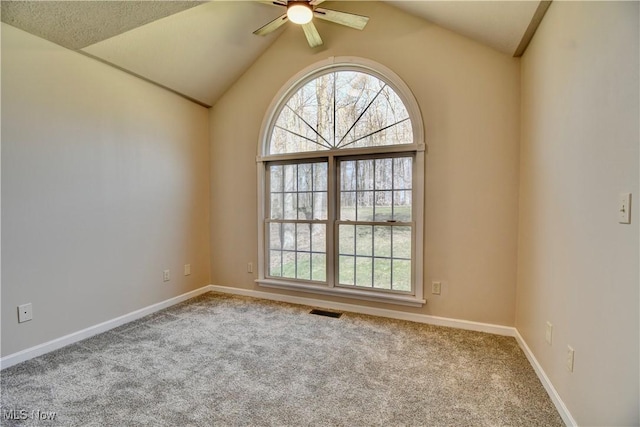 unfurnished room featuring a healthy amount of sunlight, a ceiling fan, carpet flooring, and visible vents