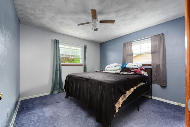 bedroom with carpet flooring, ceiling fan, and baseboards
