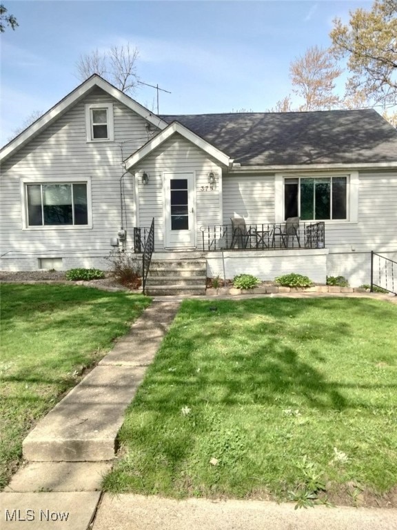 view of front of home with a front yard