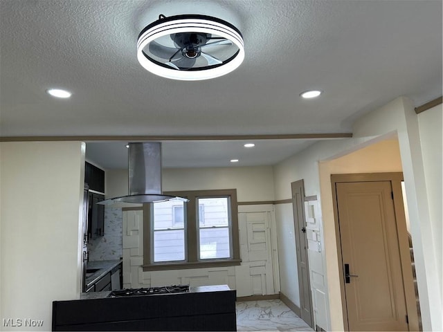 kitchen with marble finish floor, baseboards, island range hood, recessed lighting, and cooktop
