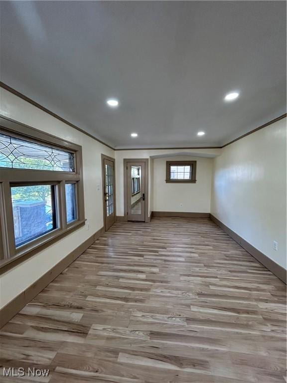 interior space with light wood-style floors, baseboards, and recessed lighting