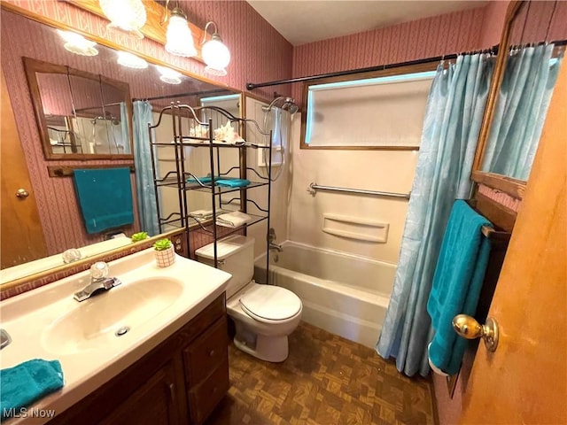 bathroom with shower / bath combo with shower curtain, vanity, toilet, and wallpapered walls