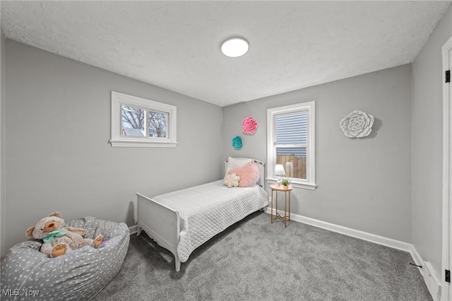 carpeted bedroom with baseboards