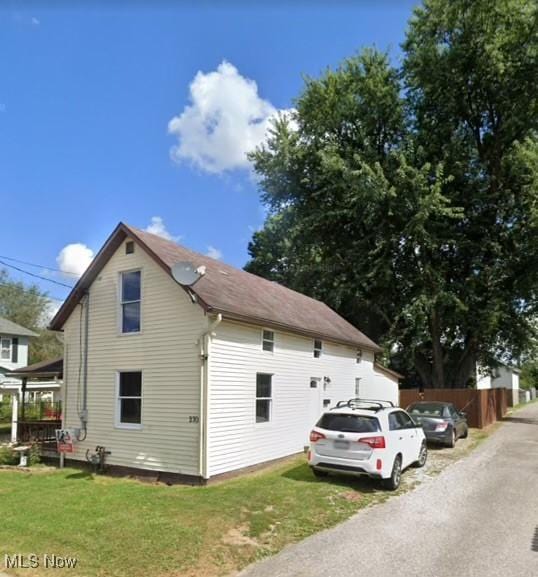 view of home's exterior with a yard