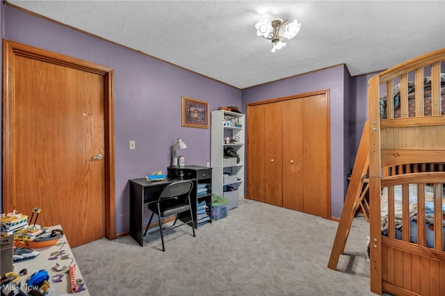carpeted bedroom with a closet