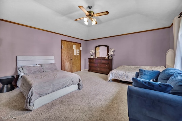 carpeted bedroom with ornamental molding and ceiling fan