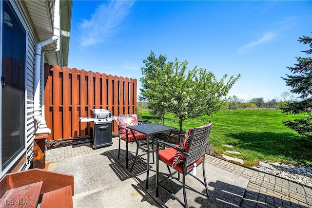view of patio with outdoor dining space and area for grilling