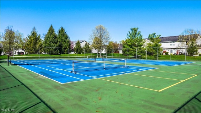 view of sport court featuring fence and community basketball court