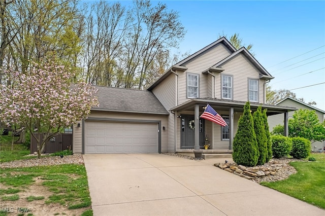 view of front of home with a porch, an attached garage, fence, and concrete driveway