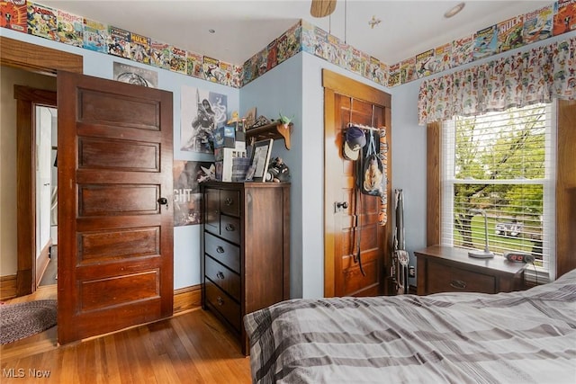 bedroom featuring ceiling fan and hardwood / wood-style flooring