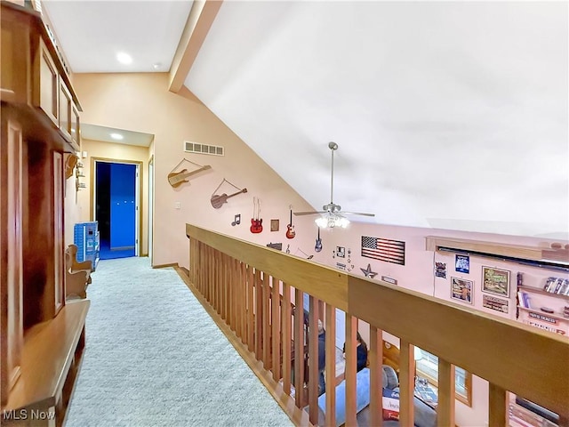 corridor featuring carpet floors, recessed lighting, visible vents, and lofted ceiling