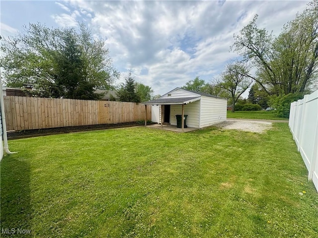 view of yard with a fenced backyard
