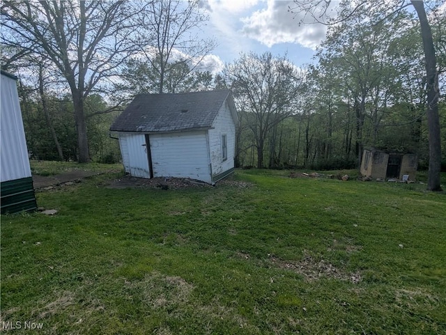 view of yard with an outdoor structure and a shed