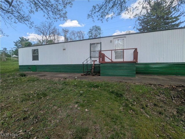 back of house with a yard