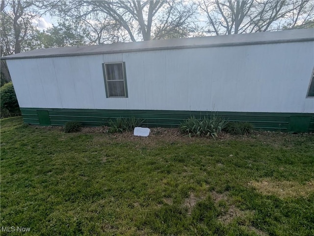 view of home's exterior featuring a lawn