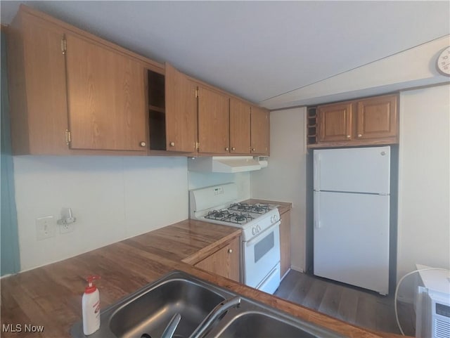 kitchen featuring brown cabinets, open shelves, under cabinet range hood, and white appliances