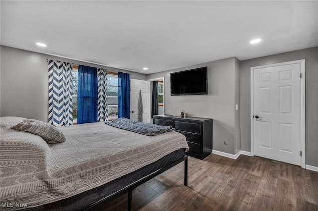 bedroom with recessed lighting, baseboards, and wood finished floors