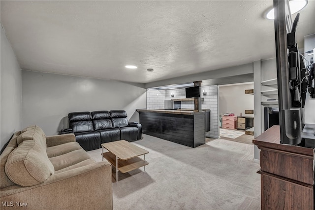 living room with light colored carpet and a textured ceiling
