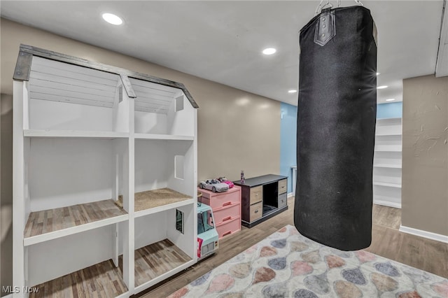 interior space featuring recessed lighting and wood finished floors