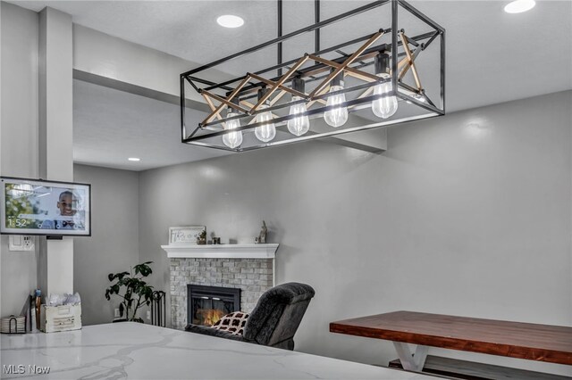 office area featuring recessed lighting and a fireplace