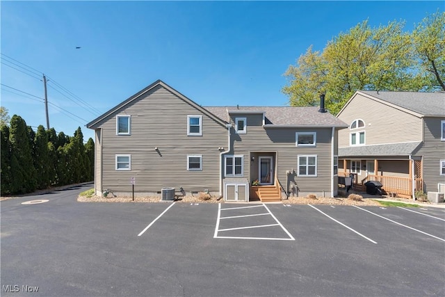 13011 W Lake Rd Unit 12C, Vermilion, OH 44089 - view of property featuring uncovered parking and central air condition unit