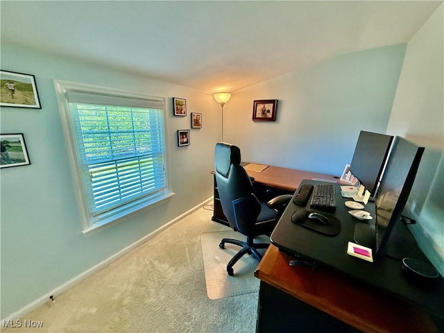 carpeted home office with baseboards