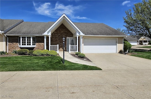 ranch-style home featuring a garage, a front lawn, roof with shingles, brick siding, and driveway
