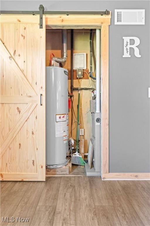 utilities featuring visible vents and water heater