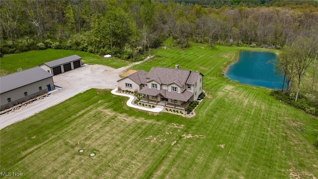 bird's eye view featuring a water view and a forest view