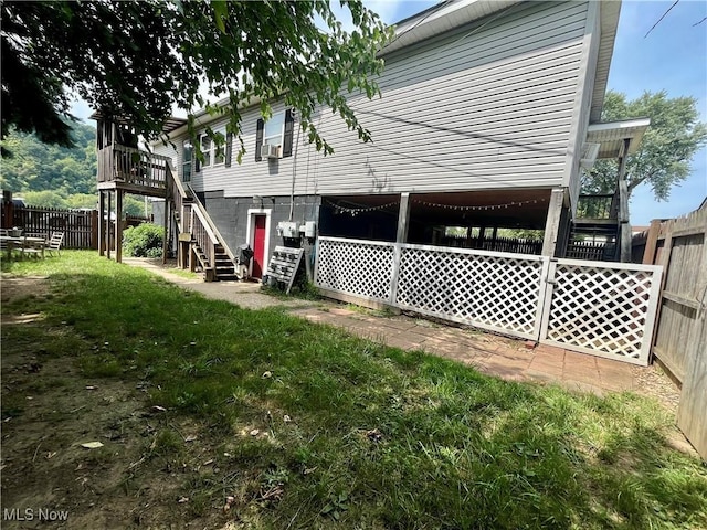 621 Grant St Rear, Rear, Mcmechen, WV 26040 - back of property featuring fence, a yard, stairway, and a deck