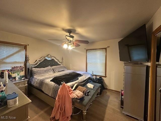 carpeted bedroom featuring ceiling fan