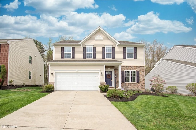 traditional-style home with an attached garage, a front lawn, driveway, and stone siding