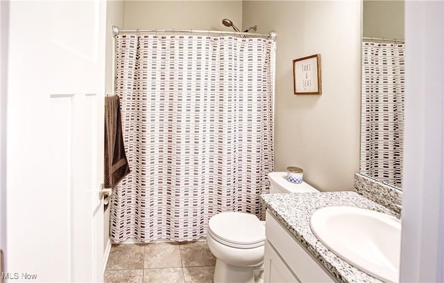 bathroom with toilet, a shower with curtain, tile patterned flooring, and vanity