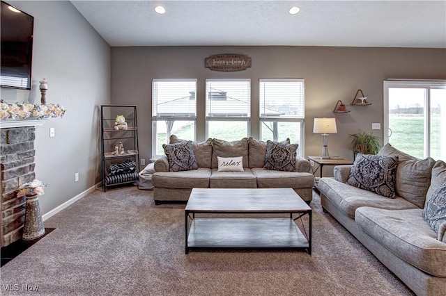 living area featuring plenty of natural light, recessed lighting, and carpet