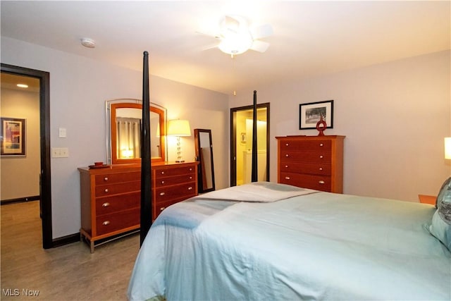bedroom featuring baseboards and ceiling fan